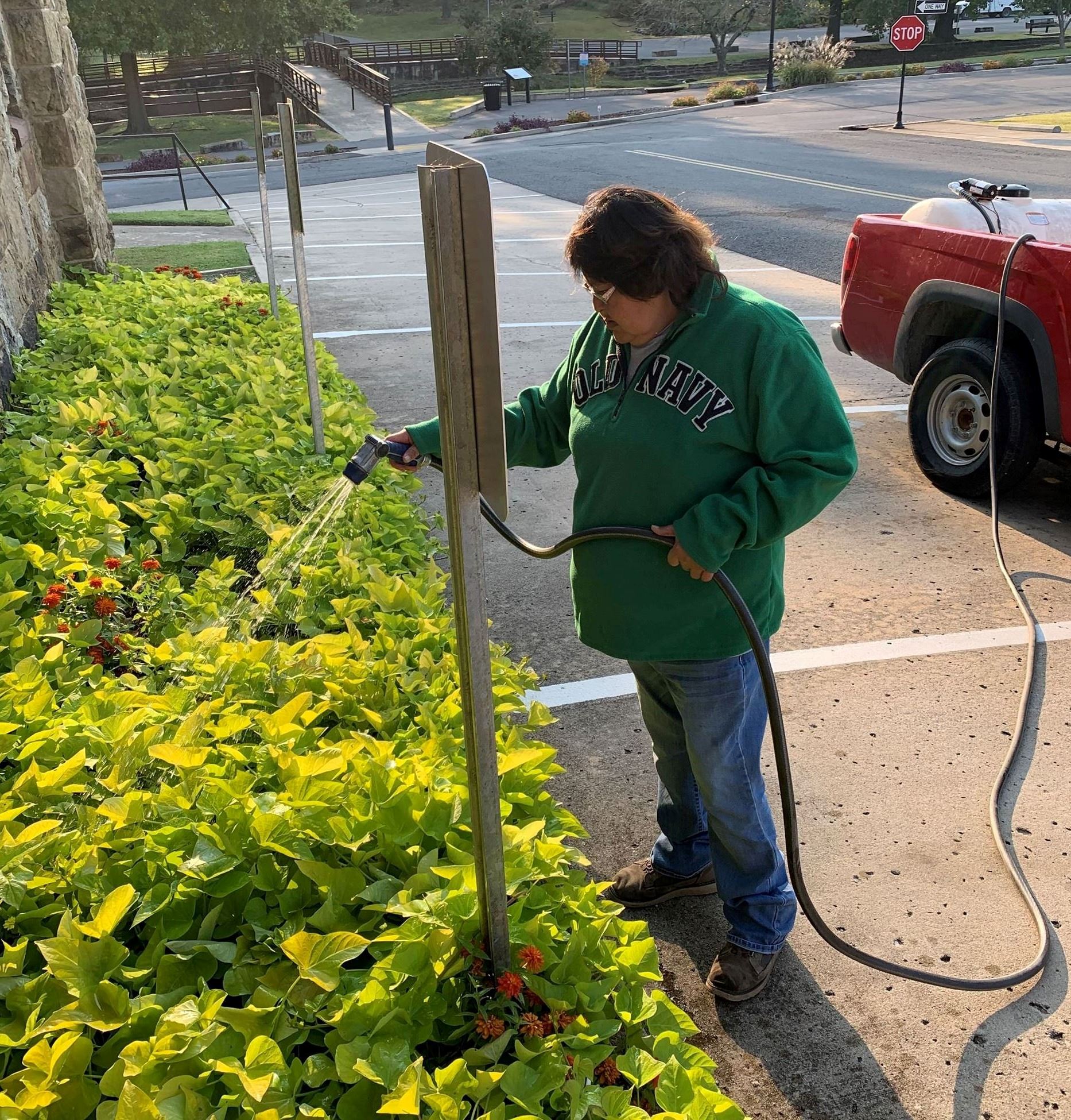Employee watering flowers(JPG)